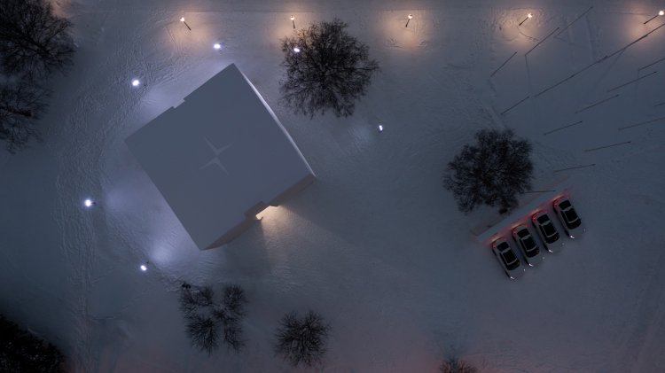 Von oben fotografierter Schneekubus inmitten einer Schneelandschaft bei Nacht.